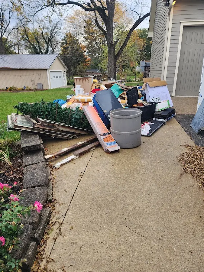 Dumpster being loaded with debris for Roofing Dumpster Rental in Mount Zion